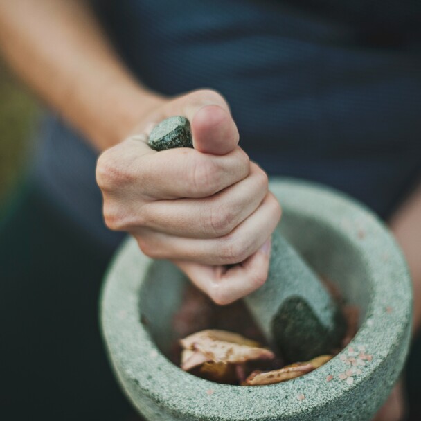 Grinding spices in Ayurveda