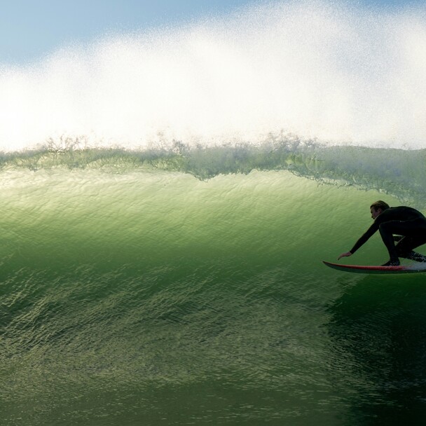 Surfer zieht in grüne Barrel, von Sonne hinterleuchtet