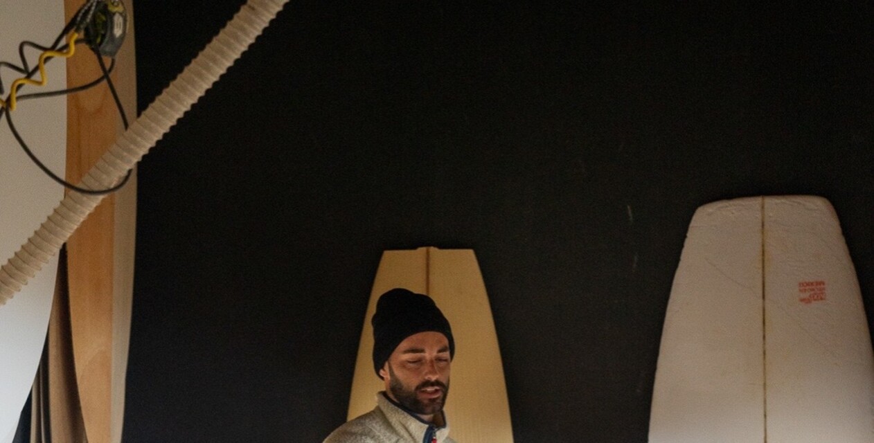 Man shaped a surfboard and paint it