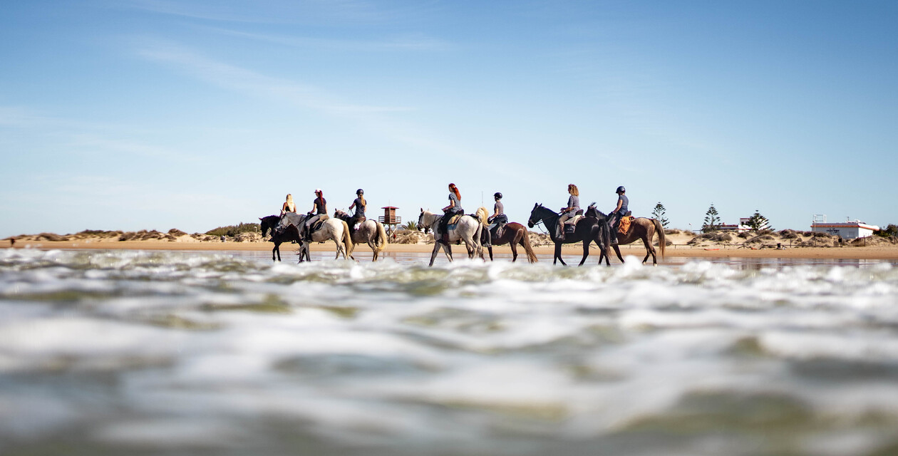 Riding on the beach, El Palmar surf camp