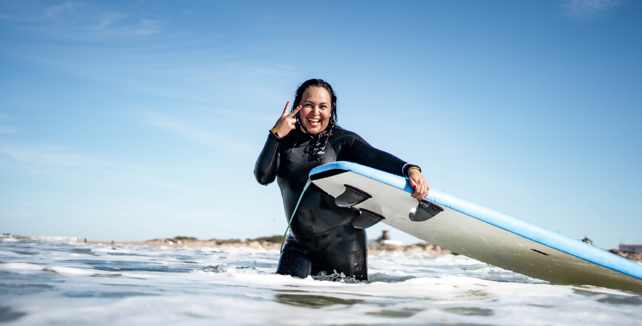 Surfer laughs and greets, Surfing Andalusia