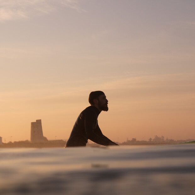 Surfing in Andalusia at sunset