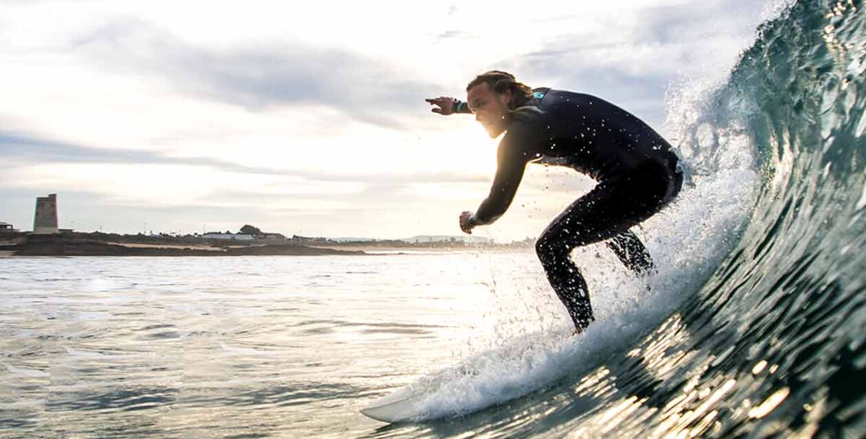 Surfer in a green wave