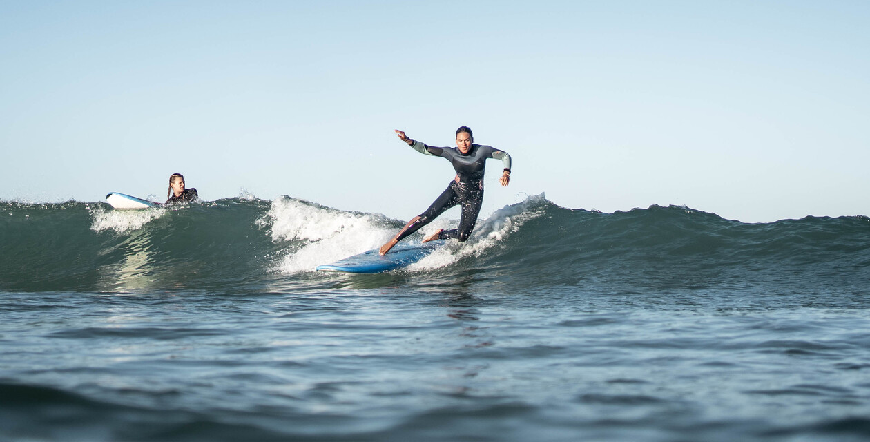 Two surfers, surf rules