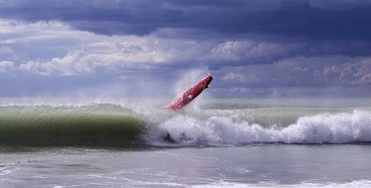 Surfboard flies through the air in the water, surfing rules