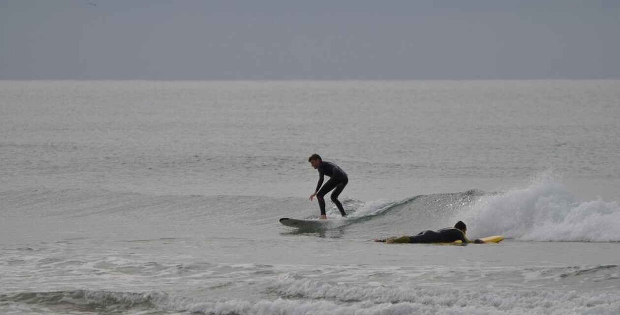 Two surfers abide by surfing rules