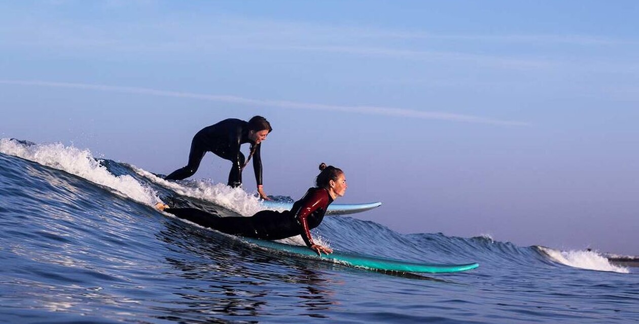 Two surfers in the line-up ,Surfing rules