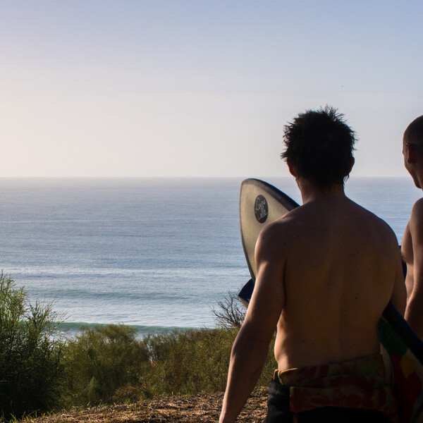 Two surfers at the surf spot check