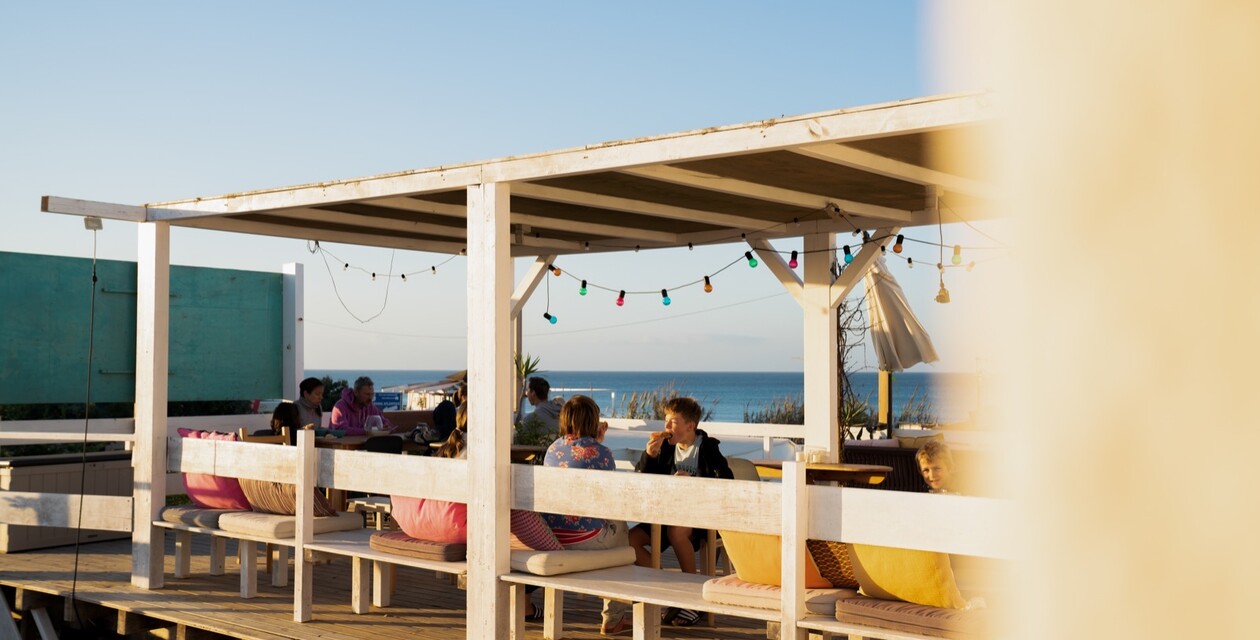 Surf vacation on the terrace of the A-Frame surf camp