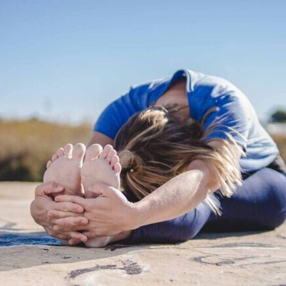 surf yoga forward bend