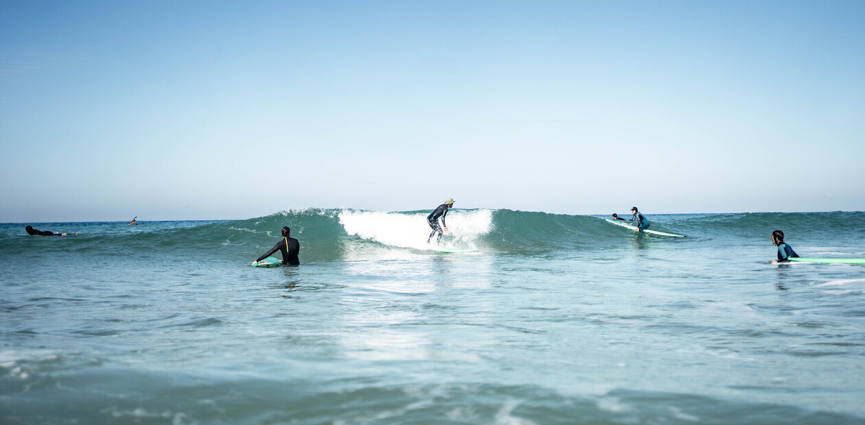 Surf camp Spain, surfers in waves