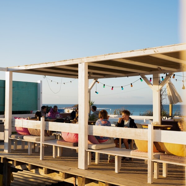 Surf camp in El Palmar with sea view, group looks out to sea from the house