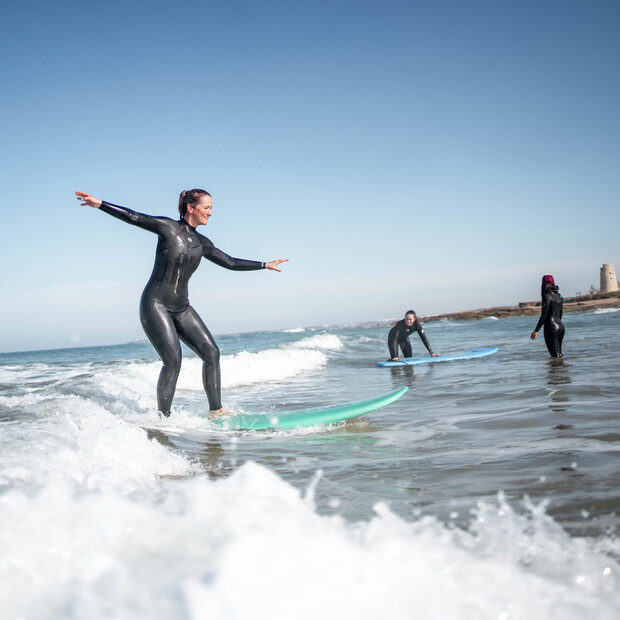 Advanced surf course in Andalusia, woman on surfboard