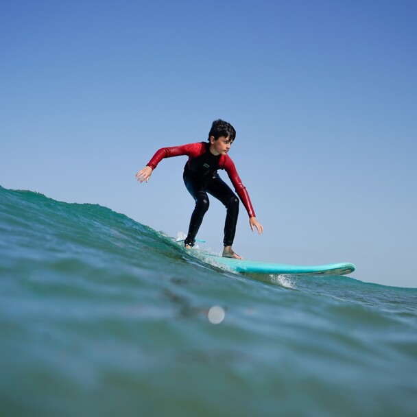 Child on a family surf course