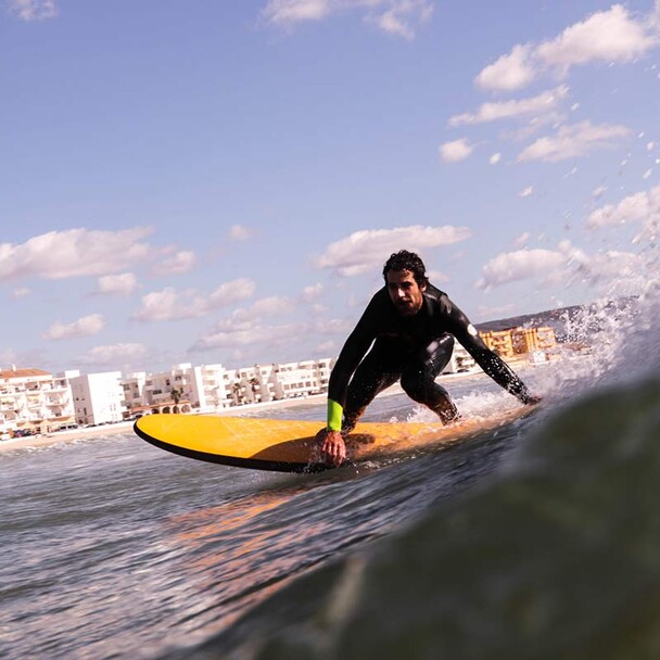 Surfing from beginner to pro, surfers in waves