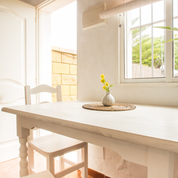 Cozy dining room with table in the surf camp Andalusia