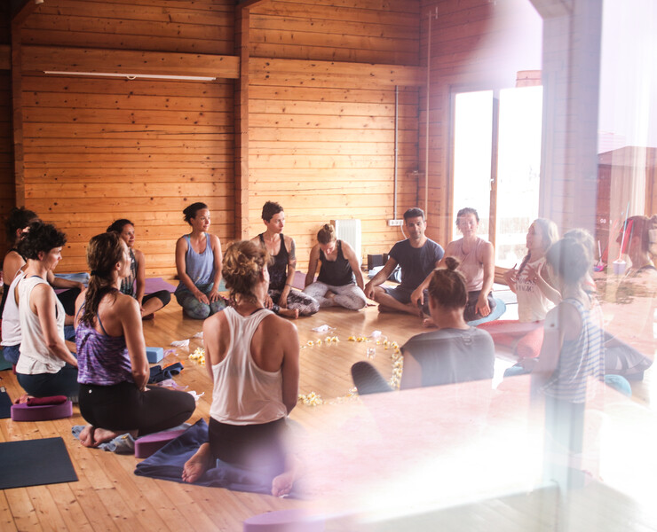 Yoga class on your yoga vacation by the sea