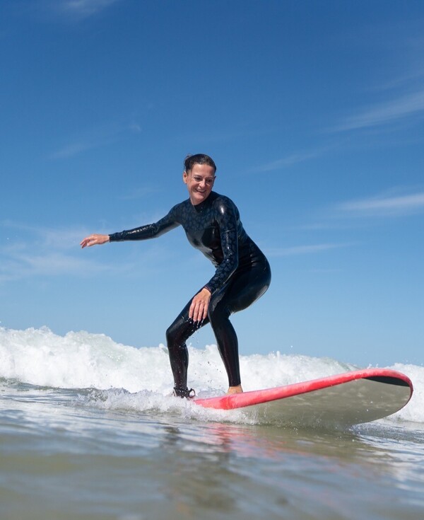 Surfing women surf camp, woman in the line-up