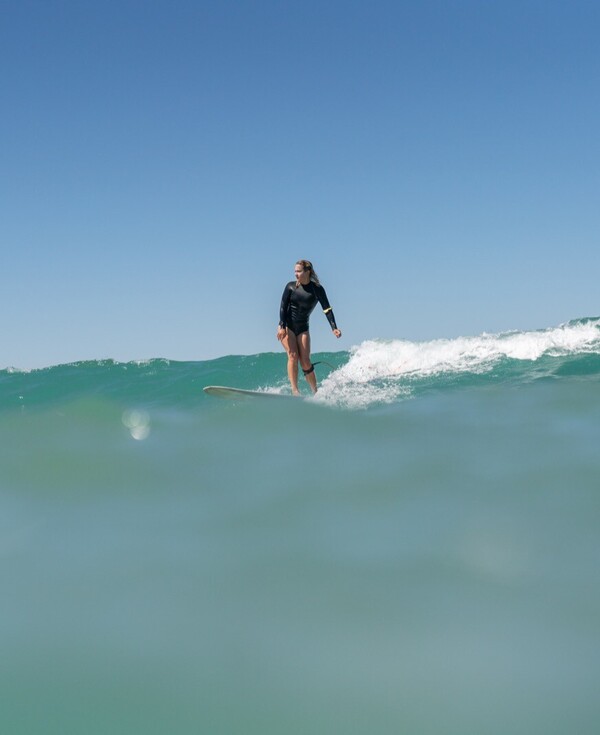 Surf camp for women, woman surfing