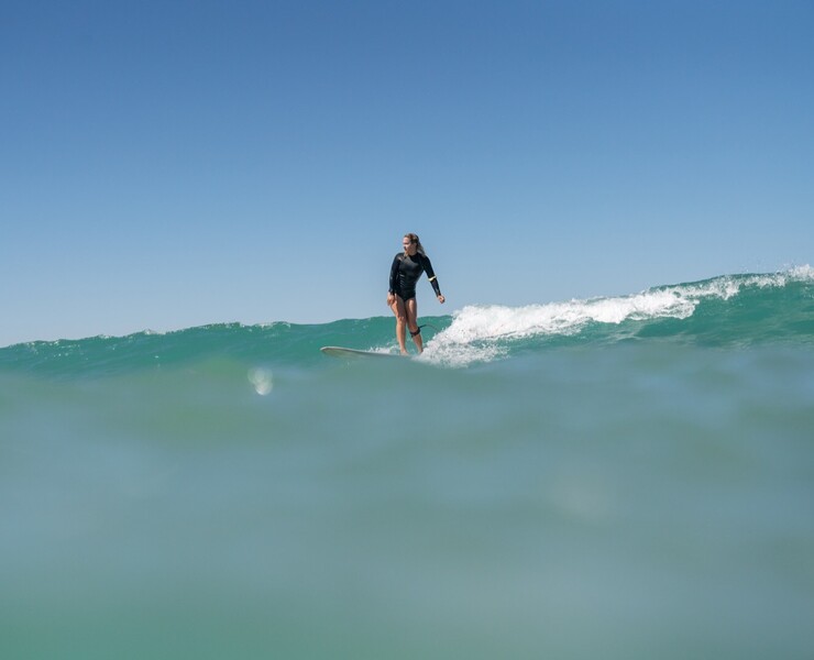 Surf camp for women, woman surfing